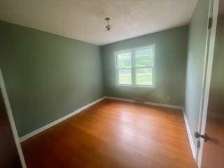 3716 W 48th St, Roeland Park, KS 66205 - empty room with wood finished floors and baseboards