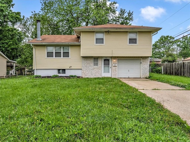 3506 S Haden Dr, Independence, MO 64055 - view of front of house with concrete driveway and a garage