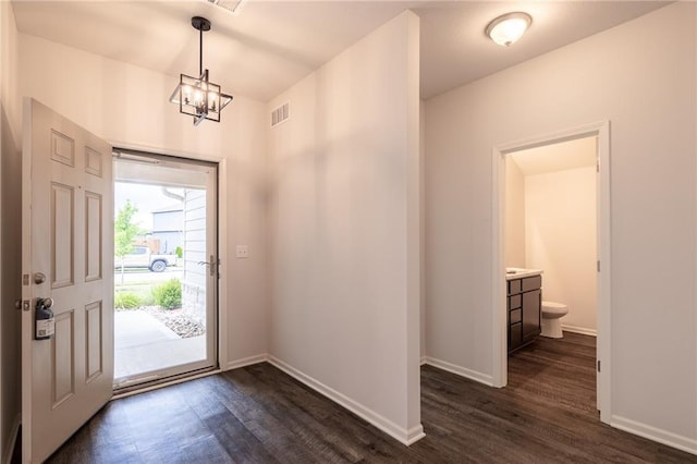 7908 SE 6th Ter, Blue Springs, MO 64014 - entryway with dark wood finished floors and a chandelier