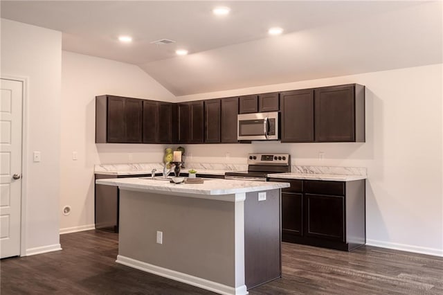 7908 SE 6th Ter, Blue Springs, MO 64014 - kitchen featuring stainless steel appliances, dark wood-style floors, an island with sink, lofted ceiling, and dark brown cabinets