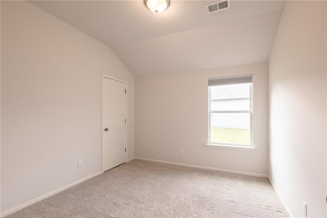7908 SE 6th Ter, Blue Springs, MO 64014 - spare room featuring light carpet and vaulted ceiling