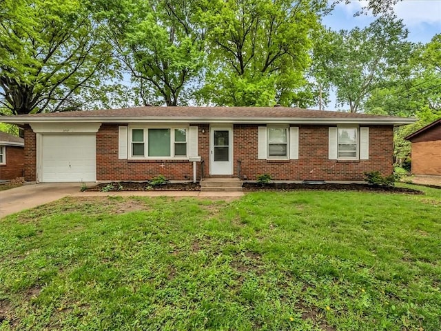 3717 S Hocker St, Independence, MO 64055 - ranch-style home with a garage, driveway, a front yard, and brick siding
