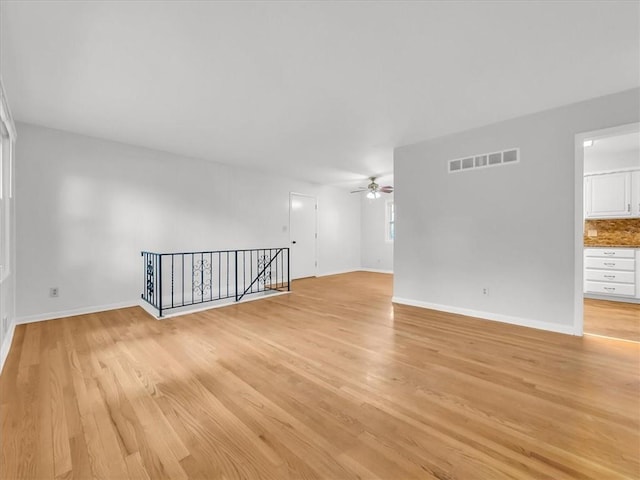 3717 S Hocker St, Independence, MO 64055 - unfurnished room with a ceiling fan and light wood finished floors