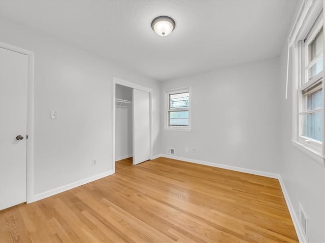 3717 S Hocker St, Independence, MO 64055 - unfurnished bedroom with light wood-style flooring and a closet