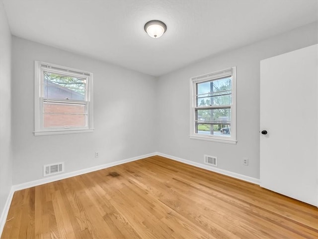 3717 S Hocker St, Independence, MO 64055 - empty room featuring plenty of natural light and light wood-type flooring