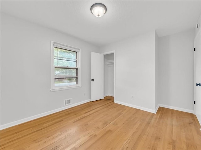 3717 S Hocker St, Independence, MO 64055 - unfurnished bedroom featuring light wood-style flooring and a closet