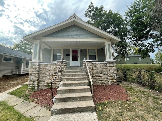 4916 Wabash Ave, Kansas City, MO 64130 - view of front of home with stone siding and covered porch
