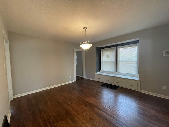 4916 Wabash Ave, Kansas City, MO 64130 - spare room featuring dark wood-style floors