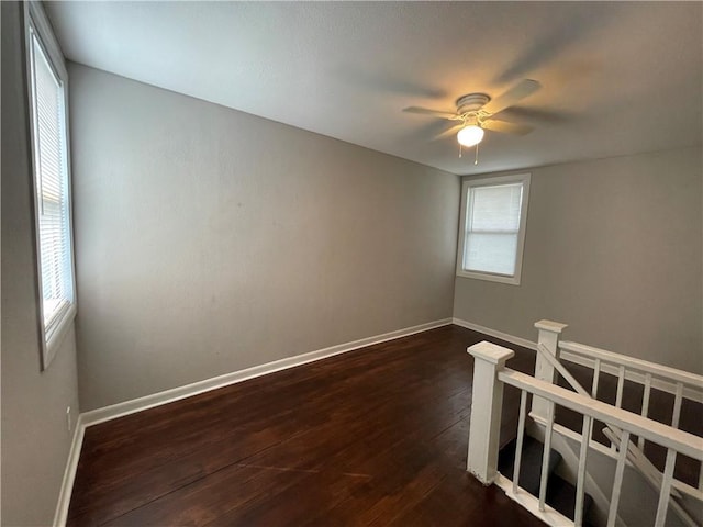 4916 Wabash Ave, Kansas City, MO 64130 - unfurnished room featuring plenty of natural light, dark wood-style floors, and ceiling fan