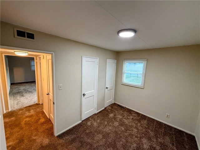 2321 Englewood Ct, Independence, MO 64052 - unfurnished bedroom featuring carpet and baseboards