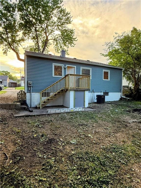 2321 Englewood Ct, Independence, MO 64052 - back of property at dusk with stairway