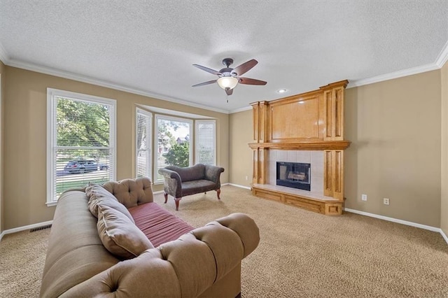 6715 W 148th Ter, Overland Park, KS 66223 - living area featuring light carpet, plenty of natural light, crown molding, a textured ceiling, and a fireplace