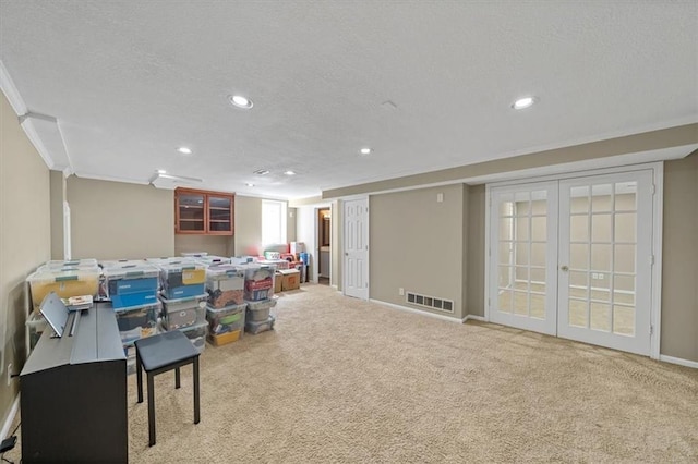 6715 W 148th Ter, Overland Park, KS 66223 - basement featuring a textured ceiling, recessed lighting, carpet floors, and french doors