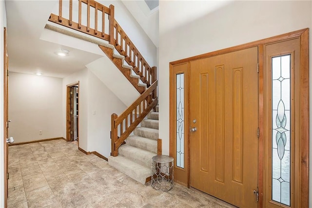 11909 Goddard St, Overland Park, KS 66213 - entrance foyer featuring stairway and baseboards