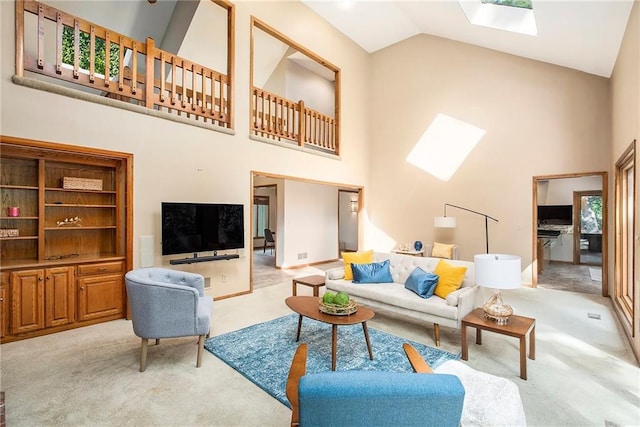 11909 Goddard St, Overland Park, KS 66213 - living room with a skylight, high vaulted ceiling, and light colored carpet