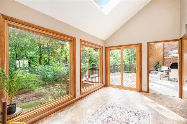 11909 Goddard St, Overland Park, KS 66213 - doorway to outside featuring a skylight, high vaulted ceiling, and a fireplace