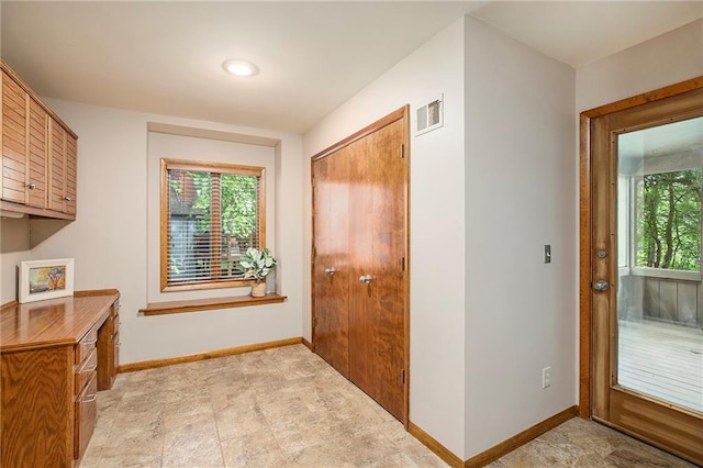 11909 Goddard St, Overland Park, KS 66213 - doorway to outside featuring plenty of natural light