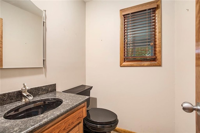 11909 Goddard St, Overland Park, KS 66213 - bathroom featuring vanity and toilet
