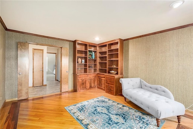 11909 Goddard St, Overland Park, KS 66213 - sitting room with wallpapered walls, crown molding, and light wood-style floors