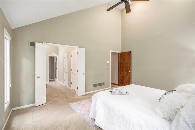 11909 Goddard St, Overland Park, KS 66213 - bedroom with high vaulted ceiling, light colored carpet, and ceiling fan