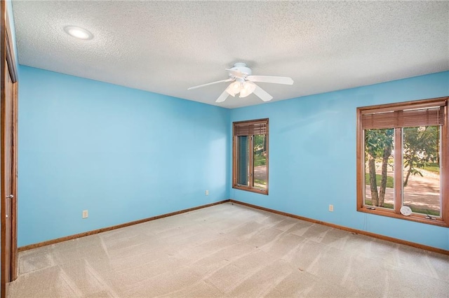11909 Goddard St, Overland Park, KS 66213 - carpeted empty room with a textured ceiling and a ceiling fan