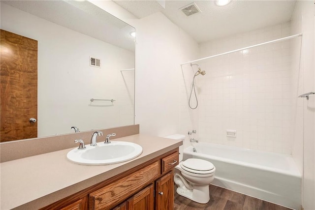 11909 Goddard St, Overland Park, KS 66213 - bathroom featuring wood finished floors, vanity, and shower / bathtub combination