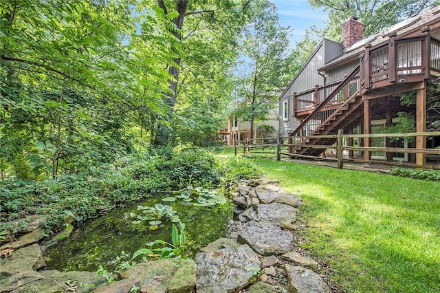 11909 Goddard St, Overland Park, KS 66213 - view of yard featuring stairway and a deck