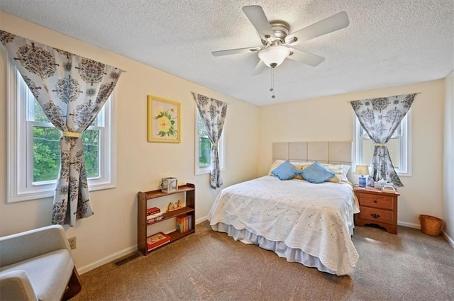 1621 Vilas St, Leavenworth, KS 66048 - bedroom with carpet floors, a textured ceiling, and ceiling fan