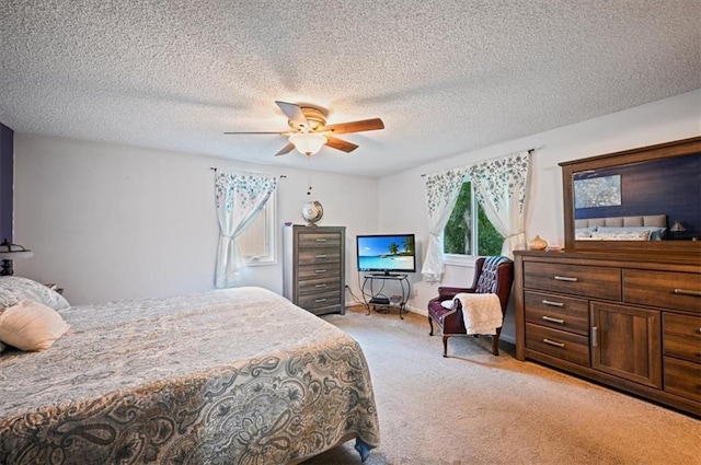 1621 Vilas St, Leavenworth, KS 66048 - bedroom with light colored carpet, a ceiling fan, and a textured ceiling