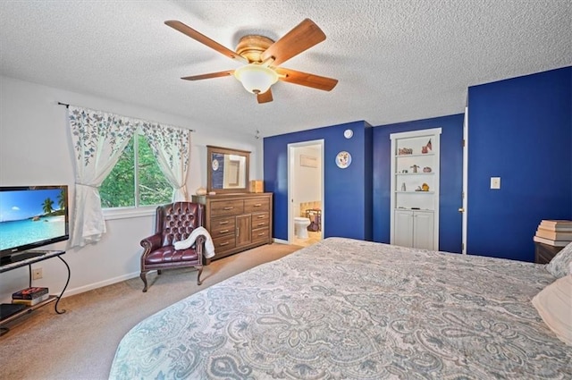 1621 Vilas St, Leavenworth, KS 66048 - carpeted bedroom with a textured ceiling, ceiling fan, and ensuite bathroom