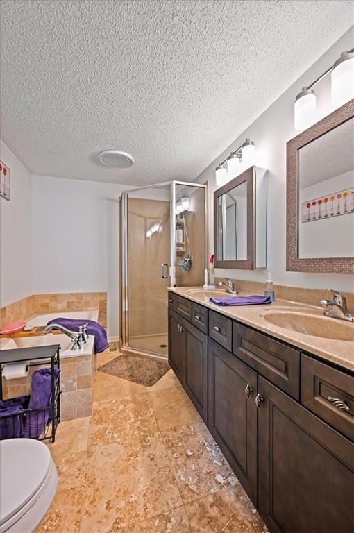 1621 Vilas St, Leavenworth, KS 66048 - full bath featuring double vanity, a stall shower, a bath, and a textured ceiling
