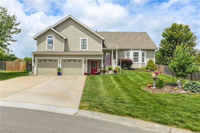 407 Maple Ct, Lansing, KS 66043 - view of front of property featuring a garage and concrete driveway