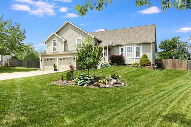 407 Maple Ct, Lansing, KS 66043 - view of front of house featuring an attached garage and concrete driveway