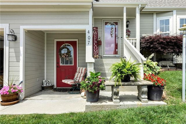 407 Maple Ct, Lansing, KS 66043 - doorway to property with roof with shingles and a porch