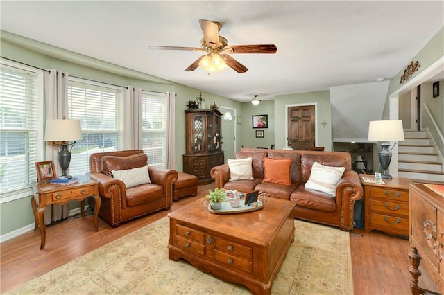 407 Maple Ct, Lansing, KS 66043 - living room with ceiling fan, wood finished floors, and stairway