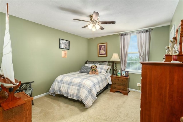 407 Maple Ct, Lansing, KS 66043 - carpeted bedroom with baseboards and a ceiling fan