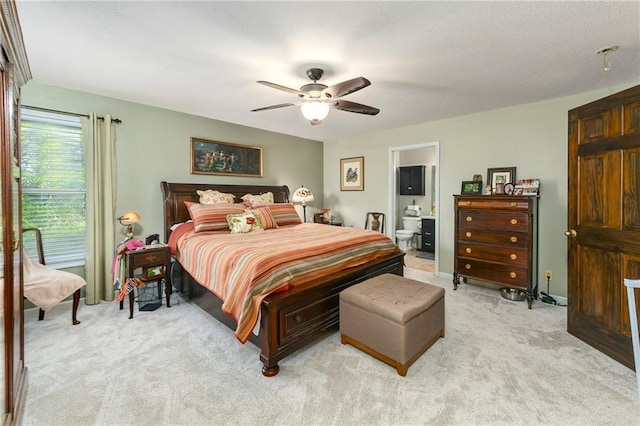 407 Maple Ct, Lansing, KS 66043 - bedroom with light carpet, a ceiling fan, and connected bathroom