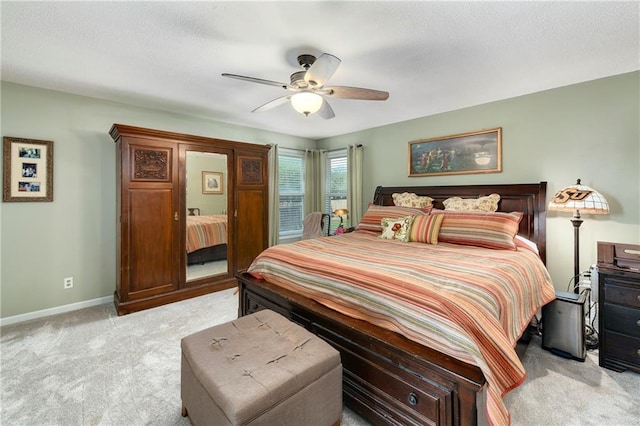 407 Maple Ct, Lansing, KS 66043 - bedroom with light colored carpet, ceiling fan, and a textured ceiling