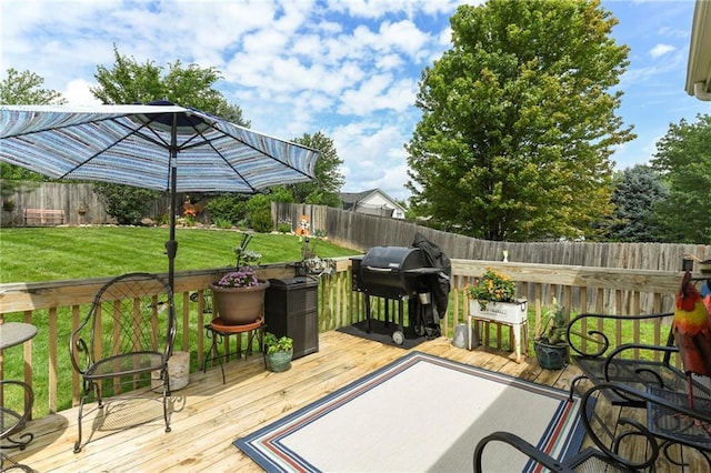 407 Maple Ct, Lansing, KS 66043 - wooden terrace with grilling area and a fenced backyard