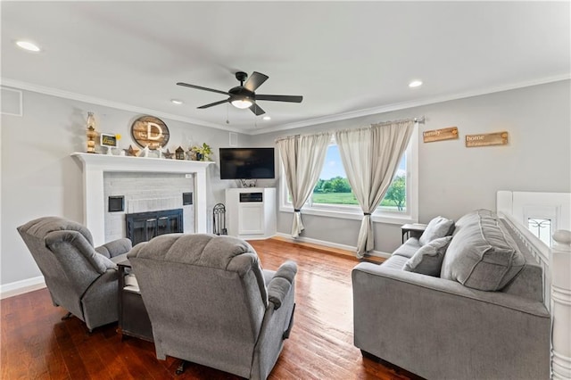 10708 E 301st St, Drexel, MO 64742 - living area with a fireplace, dark wood finished floors, a ceiling fan, crown molding, and recessed lighting
