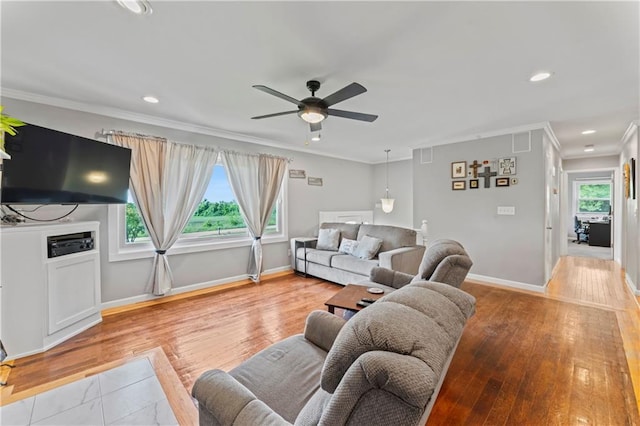 10708 E 301st St, Drexel, MO 64742 - living area featuring crown molding, ceiling fan, light wood-style floors, and recessed lighting