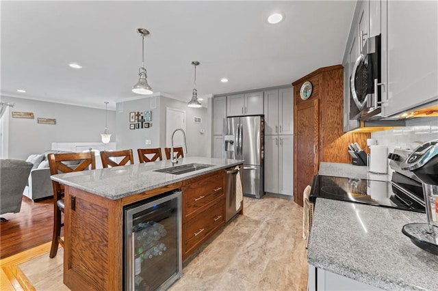 10708 E 301st St, Drexel, MO 64742 - kitchen featuring wine cooler, stainless steel appliances, a kitchen breakfast bar, ornamental molding, and recessed lighting