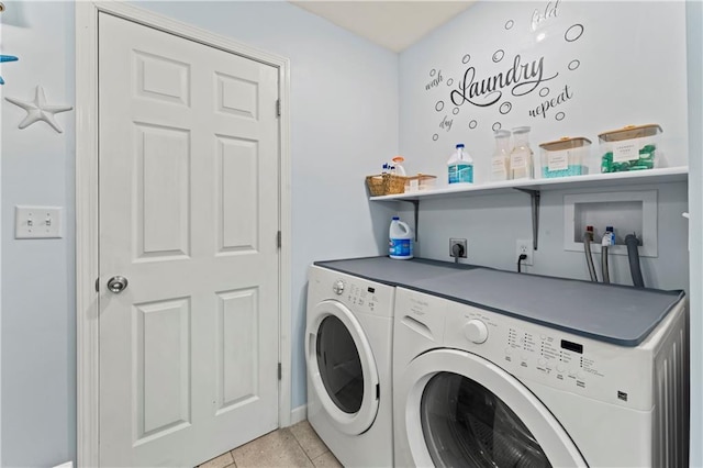 10708 E 301st St, Drexel, MO 64742 - laundry room featuring washer and clothes dryer and light tile patterned floors