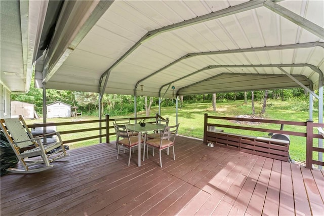 10708 E 301st St, Drexel, MO 64742 - wooden terrace featuring a shed, outdoor dining area, and a lawn
