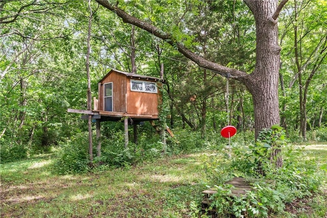 10708 E 301st St, Drexel, MO 64742 - view of outbuilding featuring a forest view