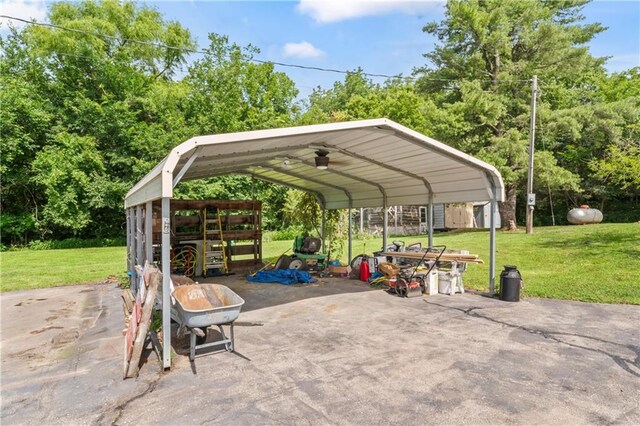 10708 E 301st St, Drexel, MO 64742 - view of patio with a carport and a shed