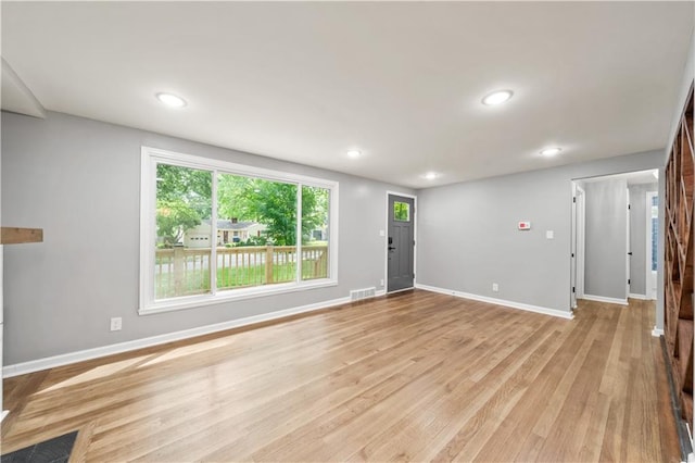 4301 W 74th St, Prairie Village, KS 66208 - unfurnished living room featuring light wood-style flooring and recessed lighting