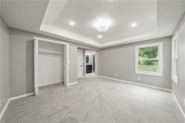 4301 W 74th St, Prairie Village, KS 66208 - unfurnished bedroom with a raised ceiling, carpet floors, recessed lighting, and a closet