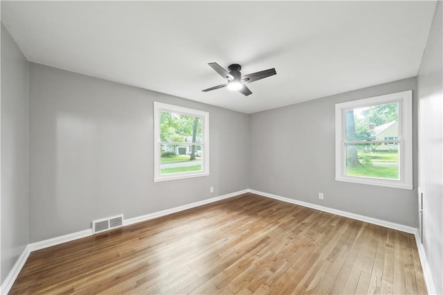 4301 W 74th St, Prairie Village, KS 66208 - unfurnished room featuring plenty of natural light, light wood-style flooring, and a ceiling fan