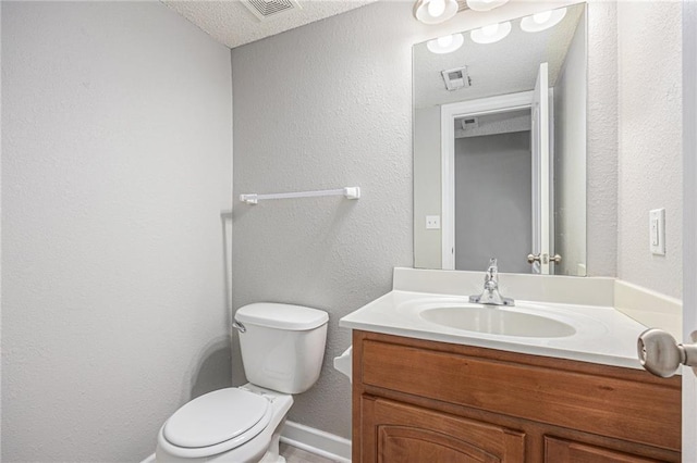 902 SW Peach Tree Ln, Blue Springs, MO 64064 - bathroom featuring vanity, a textured wall, and a textured ceiling